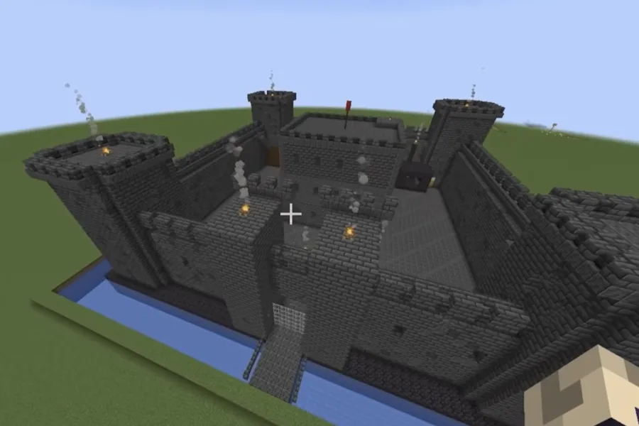 Minecraft castle built by a general AI chatbot: flat grey walls around an empty yard