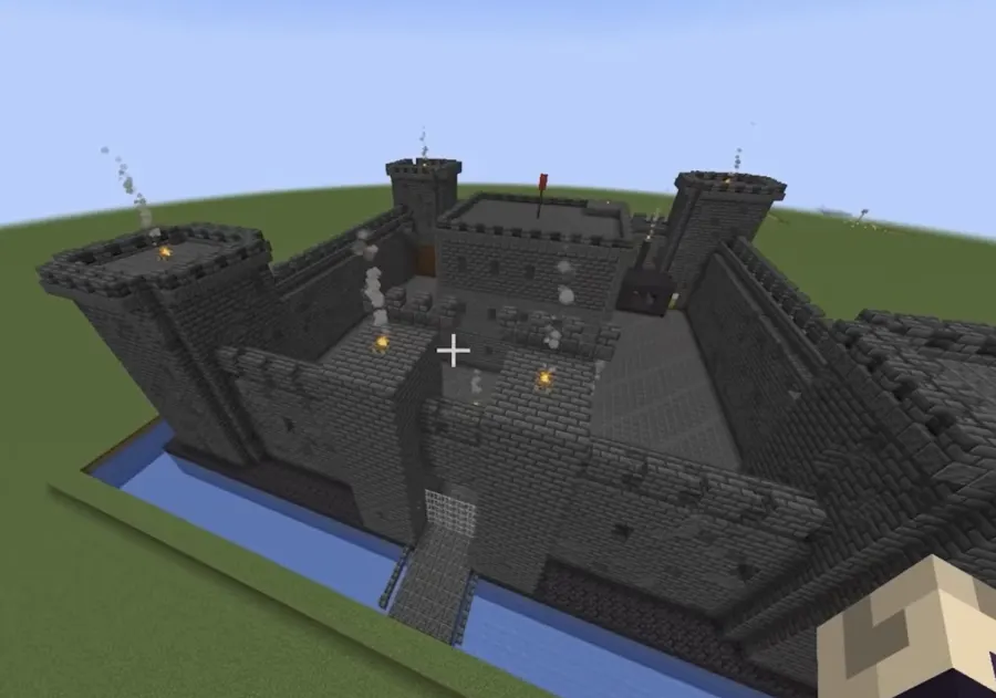 Dark stone Minecraft castle with a moat built by ChatGPT 5.6