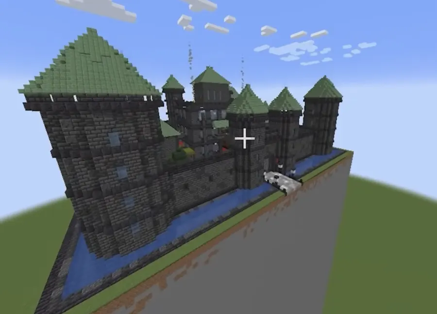 Minecraft castle with tall towers and green spires built by Kimi K3