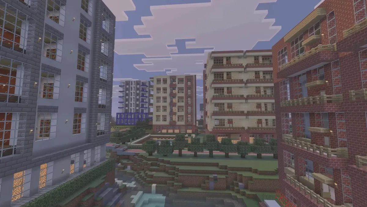 Apartment buildings with balconies around a landscaped courtyard in Mike Tomlin's Minecraft city