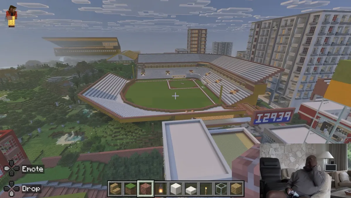 A sports stadium surrounded by high-rise apartments in Mike Tomlin's Minecraft city